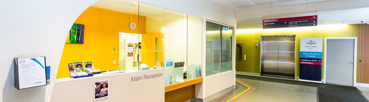 A side view of the Mercy Health Werribee hospital main reception desk.