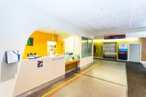 A side view of the Mercy Health Werribee hospital main reception desk.